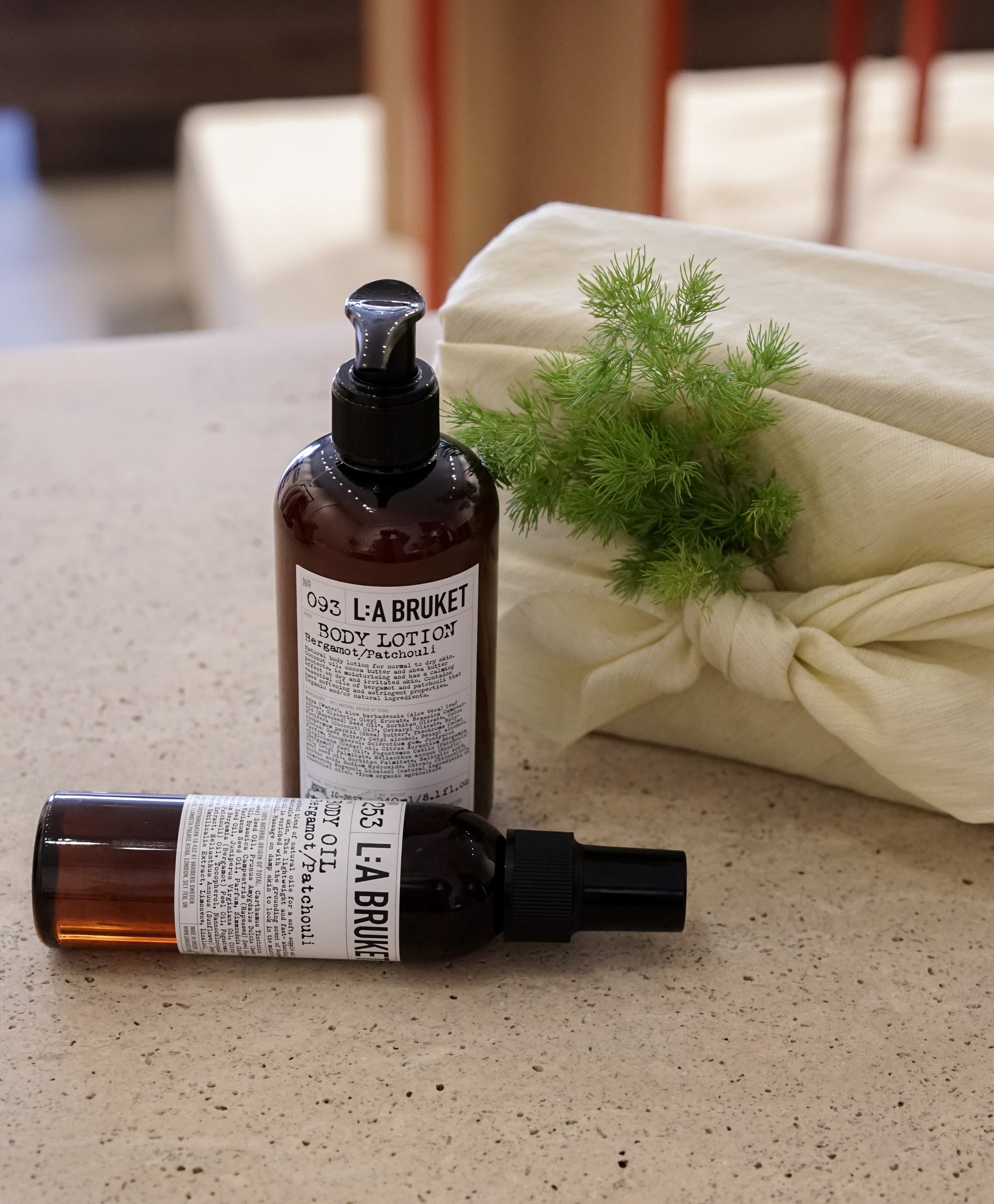L:a Bruket body lotion and body oil, paired witha. delicate custom floral bouquet